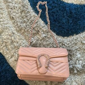 Pinkish/salmon colored purse